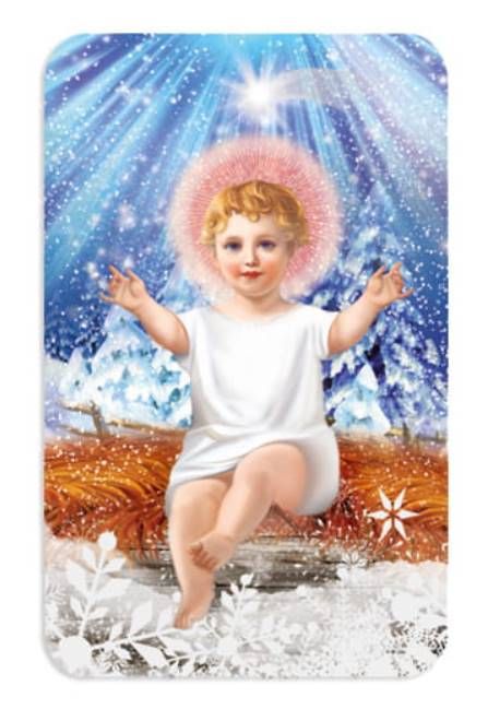Magnes religijny z uśmiechniętym dzieciątkiem Jezus na zimowym tle, format 8x5cm