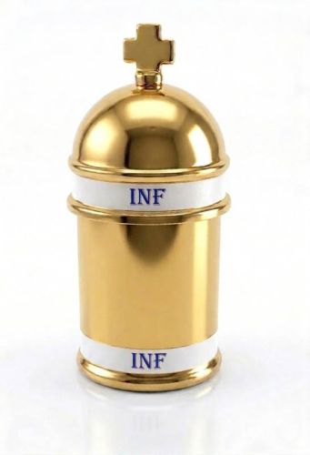 Złocone naczynko na olej święty INF z krzyżem na wieczku, przeznaczone do przechowywania oleju chorych używanego w sakramencie namaszczenia chorych.