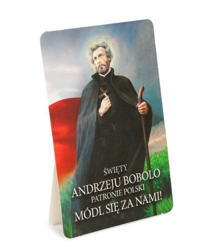 Obrazek św. Andrzeja Boboli z podpórką – patron Polski z krzyżem i laską na tle biało-czerwonej flagi.